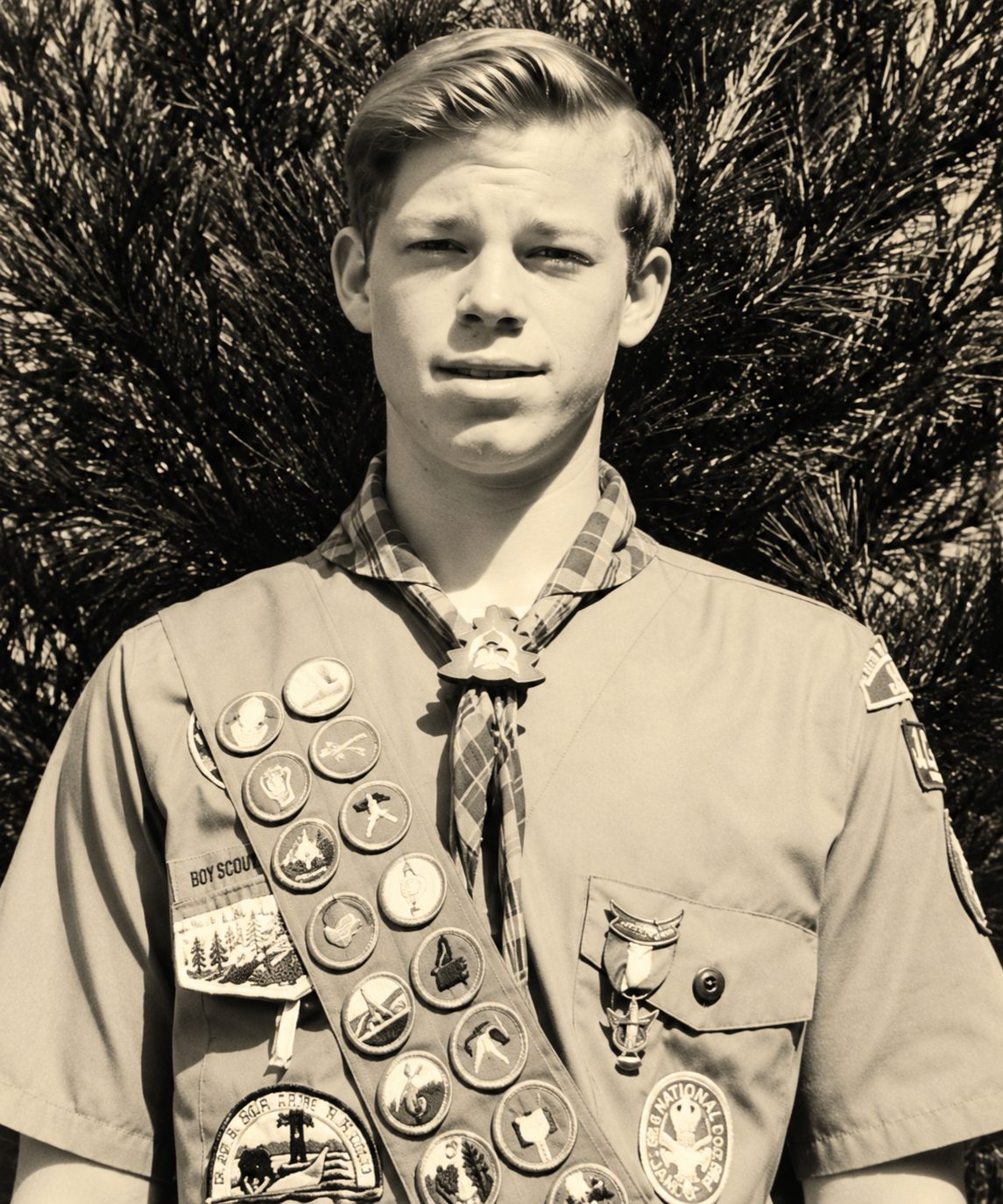 Rob Guthrie as a young Eagle Scout in uniform with his merit badge sash